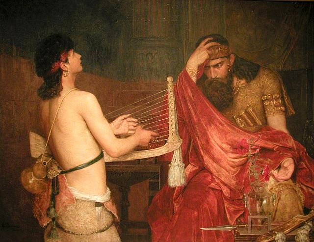 King Saul being envious of young David playing the harp